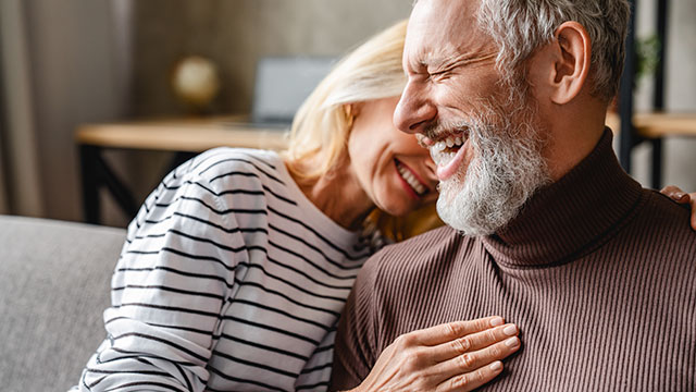 Old couple laughing