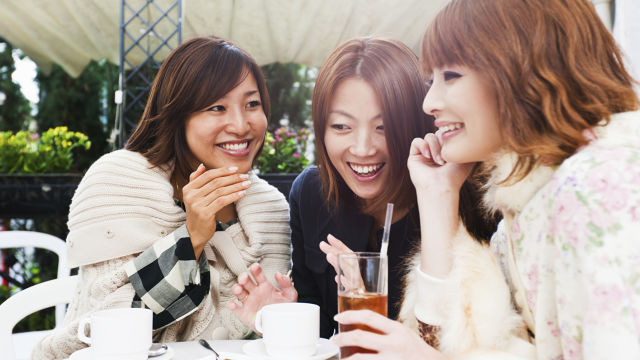 Three women smiling
