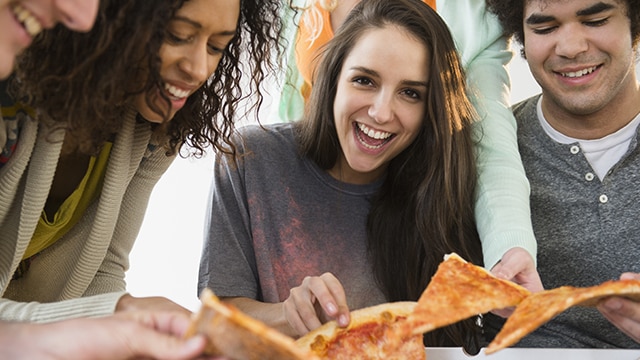 Friends sharing a pizza