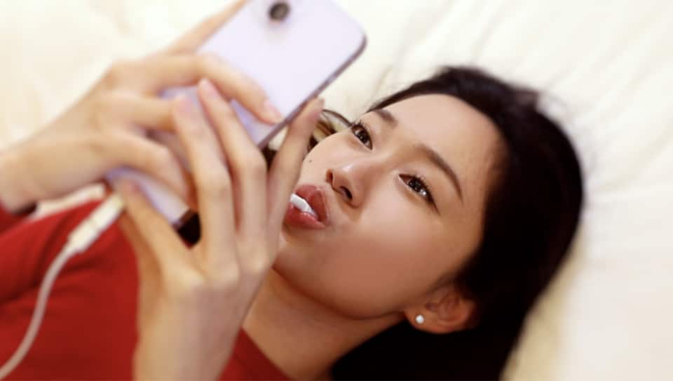 Lady with flexlight device in her mouth Lady with flexlight device in her mouth