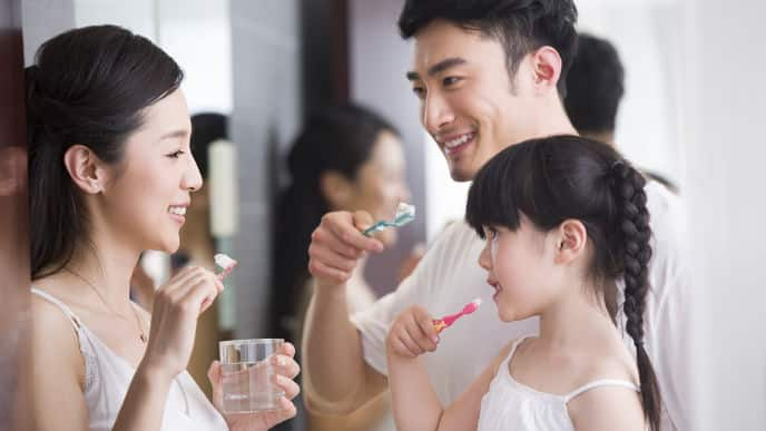 Family brushing teeth