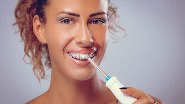 types and benefits of electric flosser - colgate au