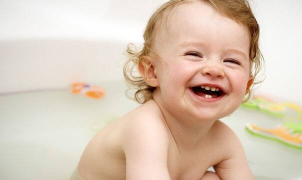 baby teething and having a bath