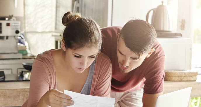 couple looking at info on dry socket