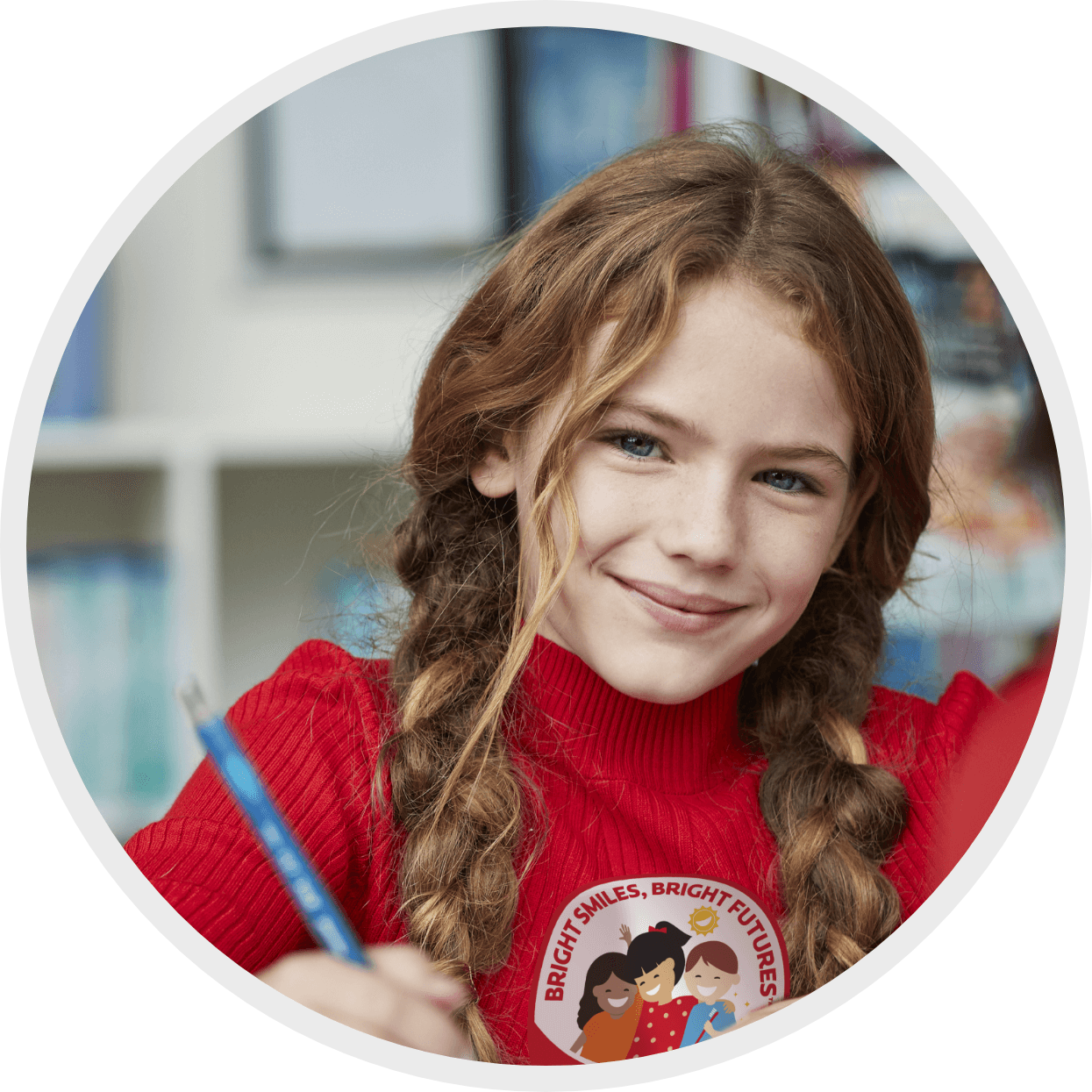 Kid smiling while she does her homework