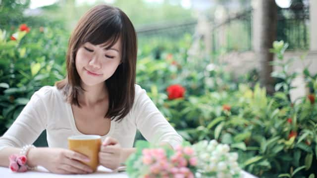 Girl holding cup