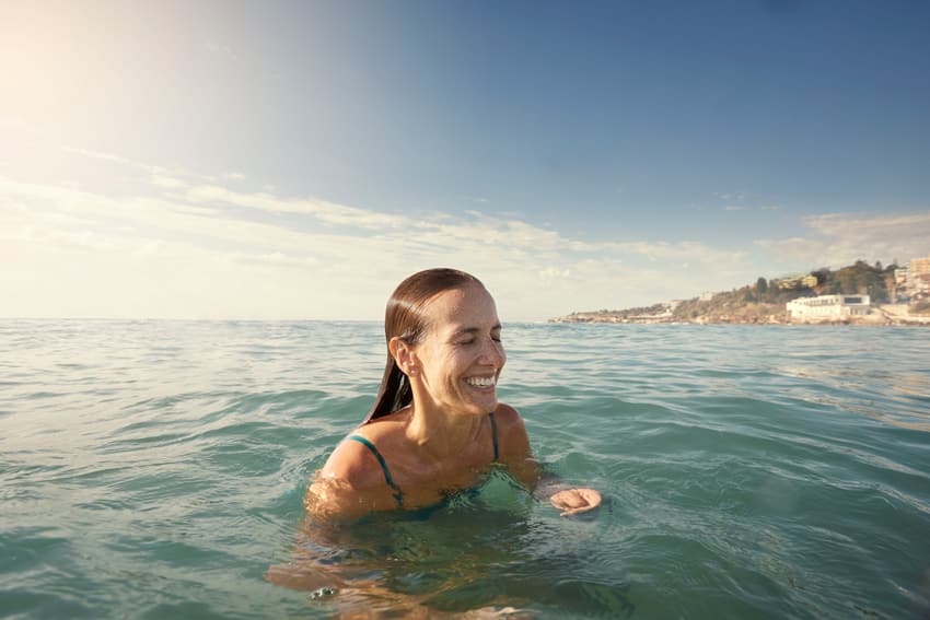 Woman laughing on the sea